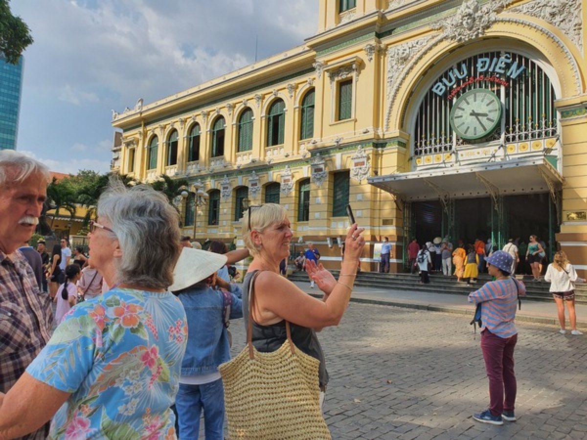 Visitors at the Saigon Central Post Office, one of the city's landmark buildings